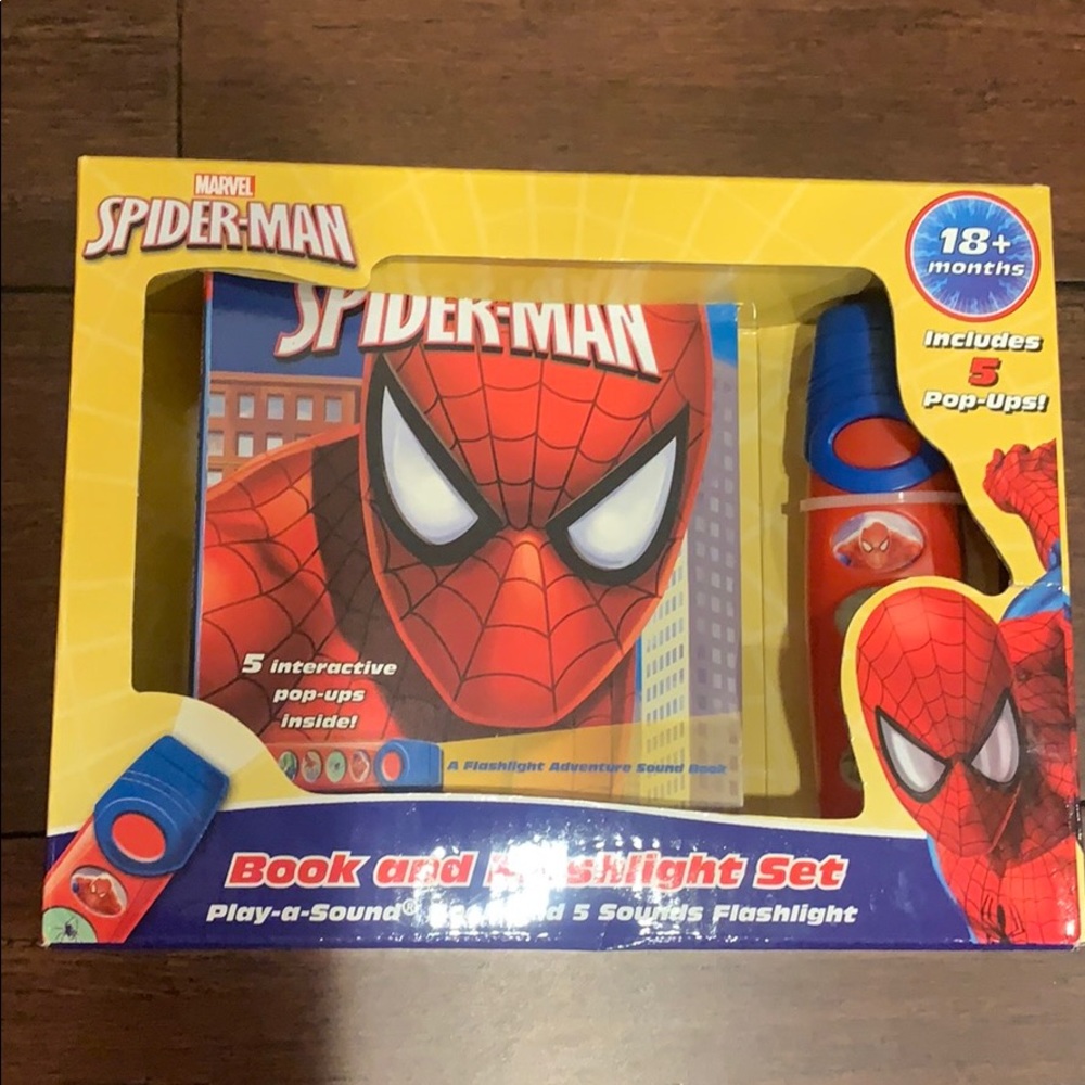 Spider-Man figure and book with flashlight